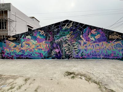 Violet and Beige and Cyan Stylewriting by Sakey, Blatz1, Toel and Rian Backend. This Graffiti is located in Jambi City, Indonesia and was created in 2022. This Graffiti can be described as Stylewriting, Characters and Murals.