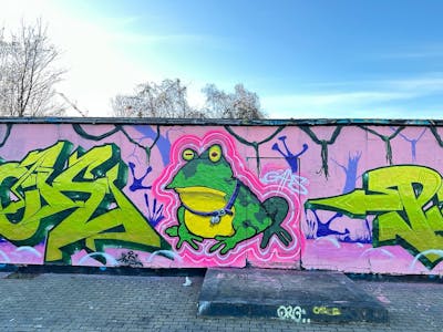 Coralle and Light Green Stylewriting by Gaps, Brick and Piksr. This Graffiti is located in Leipzig, Germany and was created in 2024. This Graffiti can be described as Stylewriting, Characters and Wall of Fame.