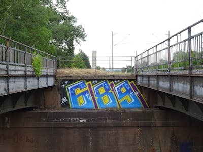 Light Blue and Yellow Stylewriting by 689 and 689ers. This Graffiti is located in Meißen, Germany and was created in 2022. This Graffiti can be described as Stylewriting and Street Bombing.