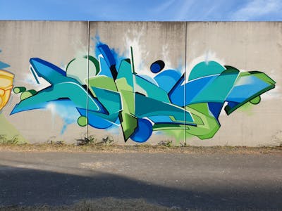 Cyan and Light Green and Blue Stylewriting by Dirt. This Graffiti is located in Leipzig, Germany and was created in 2022.