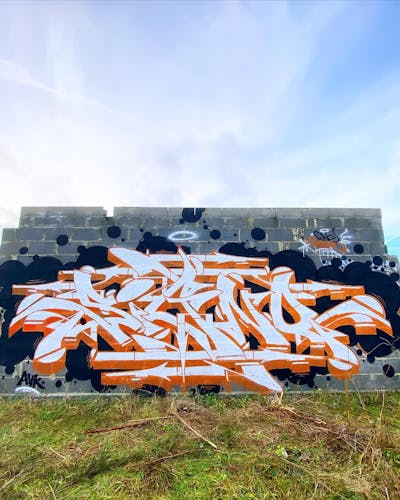 White and Black and Orange Stylewriting by Signo. This Graffiti is located in France and was created in 2023.