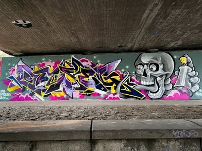Colorful and Grey Stylewriting by omseg and Kosem. This Graffiti is located in Freiburg, Germany and was created in 2023. This Graffiti can be described as Stylewriting, Characters and Wall of Fame.