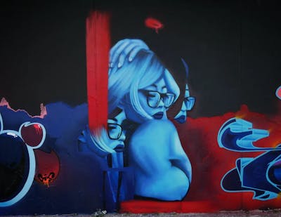 Light Blue and Red Characters by Mister Oreo. This Graffiti is located in Duisburg, Germany and was created in 2022.