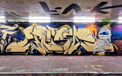 Gold and Colorful Stylewriting by Pase. This Graffiti is located in Peterborough, United Kingdom and was created in 2023. This Graffiti can be described as Stylewriting and Characters.