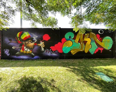 Colorful Stylewriting by NKS and TRAS. This Graffiti is located in madrid, Spain and was created in 2022. This Graffiti can be described as Stylewriting, Characters and Wall of Fame.