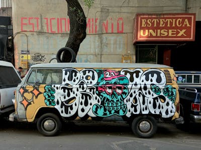 Cyan and White Stylewriting by Giusseppe. This Graffiti is located in CDMX, Mexico and was created in 2021. This Graffiti can be described as Stylewriting, Characters and Cars.