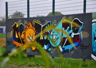 Orange and Light Blue Stylewriting by HAMPI and BISTE. This Graffiti is located in MÜNSTER, Germany and was created in 2023. This Graffiti can be described as Stylewriting, Characters and Wall of Fame.