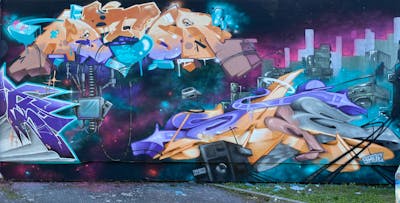 Orange and Violet and Cyan Murals by Graff.Funk, astor and sade. This Graffiti is located in Leipzig, Germany and was created in 2023. This Graffiti can be described as Murals, Stylewriting and Characters.