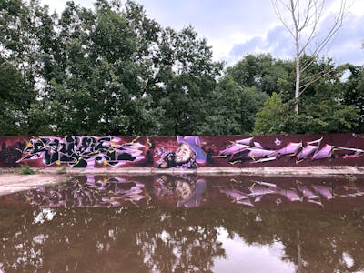 Colorful Special by Rowdy, Searok and Kan. This Graffiti is located in Döbeln, Germany and was created in 2021. This Graffiti can be described as Special, Stylewriting and Characters.