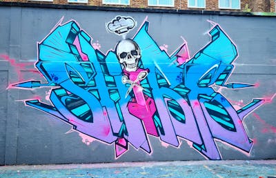 Coralle and Light Blue Stylewriting by Shibe. This Graffiti is located in London, United Kingdom and was created in 2022. This Graffiti can be described as Stylewriting, Characters and Wall of Fame.