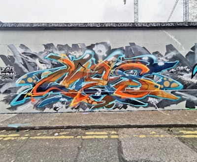 Grey and Orange and Colorful Stylewriting by Mes. This Graffiti is located in Dublin, Ireland and was created in 2024.