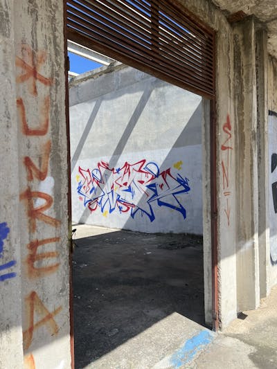 Blue and Red Stylewriting by Liver and OSP Crew. This Graffiti is located in Sibenik, Croatia and was created in 2024. This Graffiti can be described as Stylewriting, Abandoned and Atmosphere.