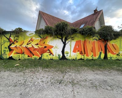 Orange and Light Green Stylewriting by Czosen1, OMIS, KOMAR and Akinu. This Graffiti is located in Grodzisk Mazowiecki, Poland and was created in 2023. This Graffiti can be described as Stylewriting and 3D.