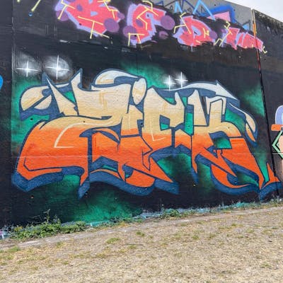 Colorful and Orange Stylewriting by ZICK and PMZ CREW. This Graffiti is located in Oldenburg, Germany and was created in 2022. This Graffiti can be described as Stylewriting and Wall of Fame.