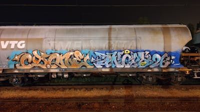 Brown and Light Blue and Colorful Stylewriting by Angel, DCK, ALL CAPS COLLECTIVE and Cyone. This Graffiti is located in Hungary and was created in 2021. This Graffiti can be described as Stylewriting, Trains and Freights.