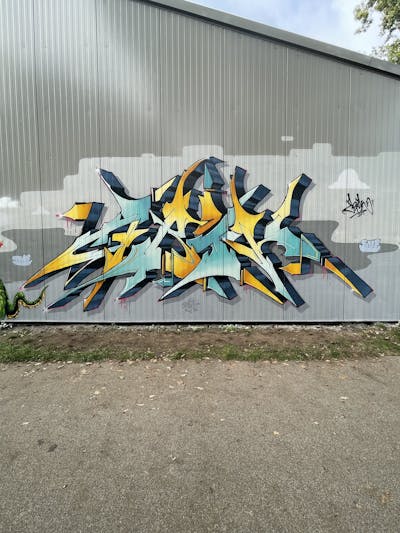 Cyan and Orange Stylewriting by Abik. This Graffiti is located in Potsdam, Germany and was created in 2022.