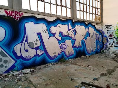 Light Blue and Blue and Chrome Stylewriting by Nerv. This Graffiti is located in Novi Sad, Serbia and was created in 2022. This Graffiti can be described as Stylewriting and Abandoned.
