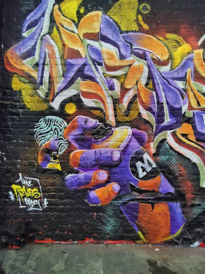 Orange and Violet Stylewriting by REVES ONE. This Graffiti is located in Belgium and was created in 2022. This Graffiti can be described as Stylewriting and Characters.
