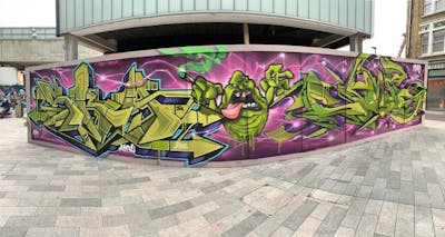 Coralle and Light Green and Violet Stylewriting by Sky High and Chips. This Graffiti is located in London, United Kingdom and was created in 2020. This Graffiti can be described as Stylewriting, Characters and Wall of Fame.