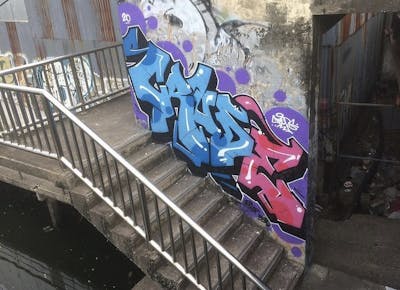 Light Blue and Coralle and Violet Stylewriting by Crude. This Graffiti is located in Bangkok, Thailand and was created in 2020. This Graffiti can be described as Stylewriting and Abandoned.