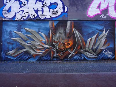 Grey and Light Blue Characters by Spektrum. This Graffiti is located in Rostock, Germany and was created in 2022. This Graffiti can be described as Characters and 3D.