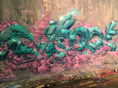 Cyan and Coralle Stylewriting by Niser and UPC. This Graffiti is located in London, United Kingdom and was created in 2023. This Graffiti can be described as Stylewriting and Wall of Fame.