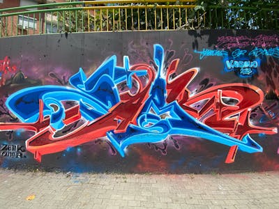 Red and Light Blue and Blue Stylewriting by Zark. This Graffiti is located in Prishtina, Kosovo and was created in 2023.