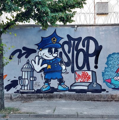 Colorful Characters by Cimet. This Graffiti is located in Zagreb, Croatia and was created in 2023. This Graffiti can be described as Characters, Streetart and Street Bombing.
