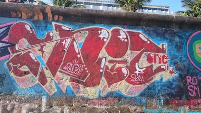Red and Colorful Stylewriting by Snit. This Graffiti is located in Rio de Janeiro, Brazil and was created in 2014. This Graffiti can be described as Stylewriting and Street Bombing.