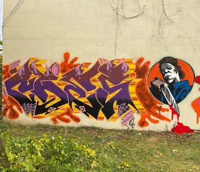 Orange and Colorful Stylewriting by Kog and CAES. This Graffiti is located in United States and was created in 2021. This Graffiti can be described as Stylewriting and Characters.