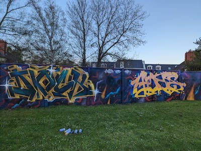 Colorful and Yellow Stylewriting by Dock, LORD and Kosh. This Graffiti is located in Caen, France and was created in 2023.