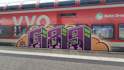 Violet and Orange and Light Green Stylewriting by 689 and 689ers. This Graffiti is located in Dresden, Germany and was created in 2023. This Graffiti can be described as Stylewriting and Trains.