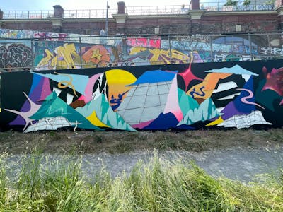 Colorful Stylewriting by Toyz, OneTwo, Myb and Terazos. This Graffiti is located in Wien, Austria and was created in 2023. This Graffiti can be described as Stylewriting, Futuristic and Wall of Fame.