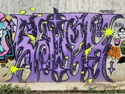 Violet and Yellow Stylewriting by M3C and Sakey. This Graffiti is located in Jambi City, Indonesia and was created in 2022.