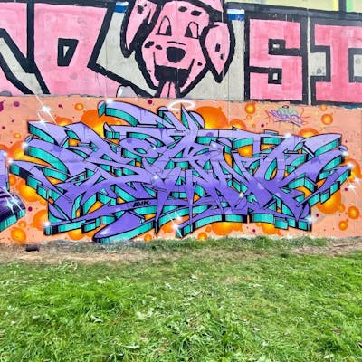 Violet and Orange and Cyan Stylewriting by Signo. This Graffiti is located in France and was created in 2023. This Graffiti can be described as Stylewriting and Wall of Fame.