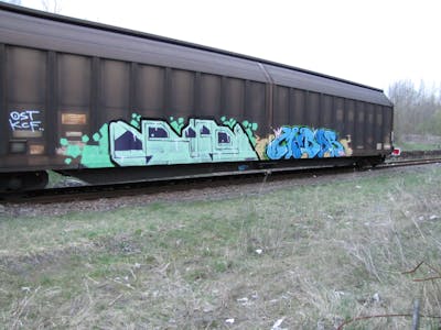 Light Green and Light Blue Stylewriting by urine, mobar and OST. This Graffiti is located in Leipzig, Germany and was created in 2009. This Graffiti can be described as Stylewriting and Trains.