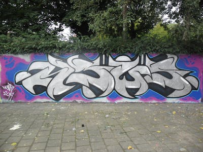 Chrome and Colorful Stylewriting by News. This Graffiti is located in Tilburg, Netherlands and was created in 2014. This Graffiti can be described as Stylewriting and Wall of Fame.