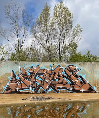 Brown and Light Blue Stylewriting by Thetan. This Graffiti is located in Italy and was created in 2022. This Graffiti can be described as Stylewriting and Abandoned.