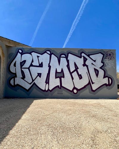 Chrome and Black and Grey Stylewriting by Bamos. This Graffiti is located in Valencia, Spain and was created in 2023. This Graffiti can be described as Stylewriting and Wall of Fame.