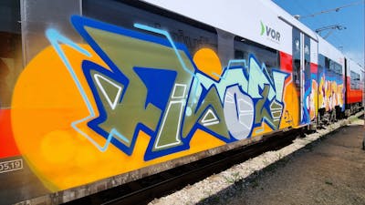 Orange and Blue and Colorful Stylewriting by Asot. This Graffiti is located in Poland and was created in 2022. This Graffiti can be described as Stylewriting and Trains.