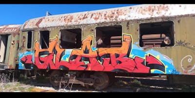 Red and Orange and Light Blue Stylewriting by GLAB. This Graffiti is located in Thessaloniki, Greece and was created in 2023. This Graffiti can be described as Stylewriting, Abandoned, Freights and Trains.