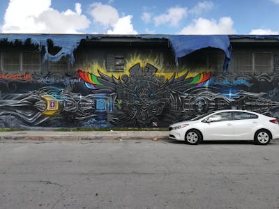 Grey and Colorful Characters by Dest Jones. This Graffiti is located in Miami, United States and was created in 2016. This Graffiti can be described as Characters, Streetart and Murals.