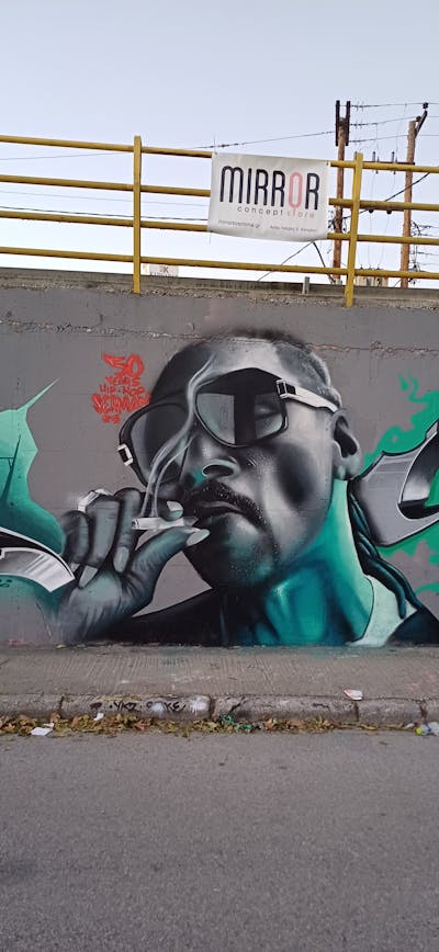 Cyan and Grey Characters by serman. This Graffiti is located in Katerini, Greece and was created in 2023.
