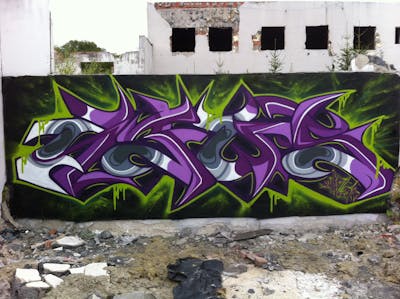 Violet and Light Green Stylewriting by News. This Graffiti is located in Walbrzych, Poland and was created in 2015. This Graffiti can be described as Stylewriting and Abandoned.