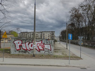 Red and White Stylewriting by Riots. This Graffiti is located in Krakow, Poland and was created in 2010. This Graffiti can be described as Stylewriting and Street Bombing.