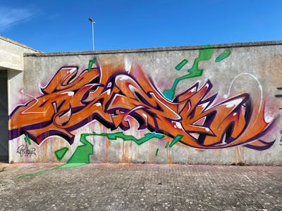 Orange Stylewriting by Zark. This Graffiti is located in Lecce, Italy and was created in 2024.