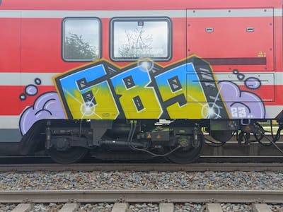 Yellow and Light Blue Stylewriting by 689 and 689ers. This Graffiti is located in Dresden, Germany and was created in 2023. This Graffiti can be described as Stylewriting and Trains.