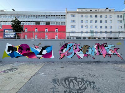 Colorful Stylewriting by Toyz and Boa One. This Graffiti is located in Wien, Austria and was created in 2021. This Graffiti can be described as Stylewriting, Futuristic and Wall of Fame.