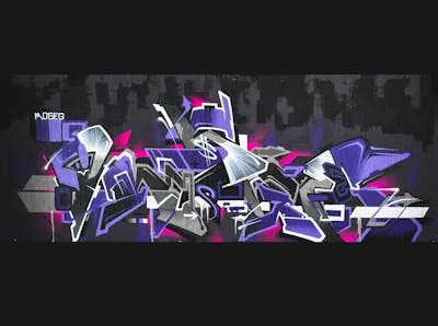 Violet and Grey Stylewriting by Moseg and omseg. This Graffiti is located in Freiburg, Germany and was created in 2022. This Graffiti can be described as Stylewriting and Wall of Fame.