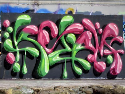 Light Green and Coralle Stylewriting by Kezam. This Graffiti is located in Auckland, New Zealand and was created in 2024. This Graffiti can be described as Stylewriting, 3D and Wall of Fame.